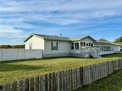 Back of property featuring a yard | Image 1