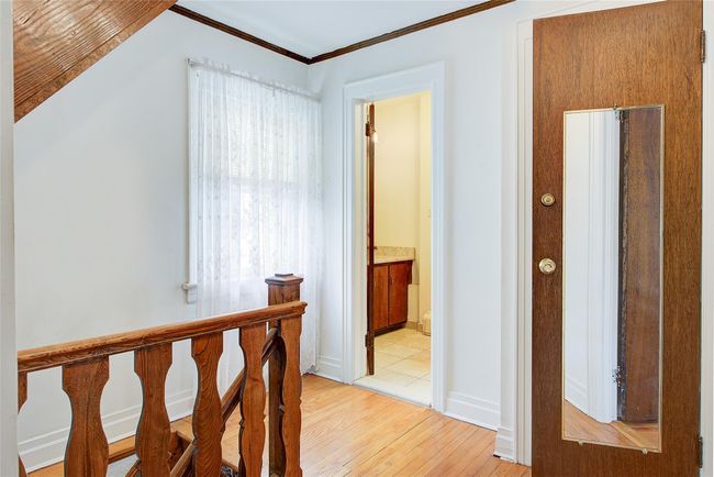 Hall featuring light wood-style floors and ornamental molding | Image 23