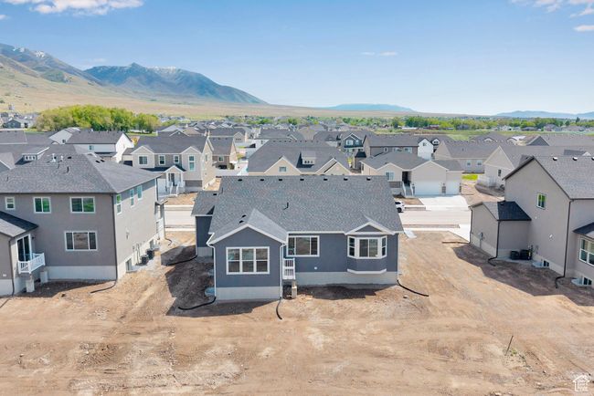 Aerial view of residential area featuring a mountain backdrop | Image 34