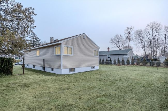 View of side of property featuring a yard | Image 4