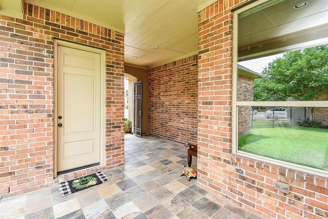 Back at the front of the home is a casita. It features another bedroom with large walk-in closet and fill bath! Use this room for multiple flex options! | Image 31