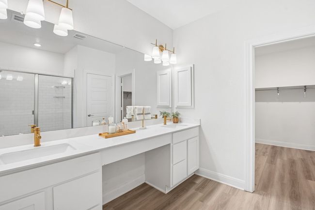 The ensuite bathroom includes a walk-in shower, double vanity, and a generous walk-in closet | Image 12