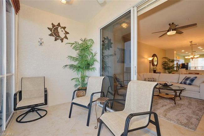 View of patio / terrace featuring ceiling fan and an outdoor hangout area | Image 12