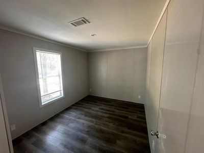 Bathroom featuring vanity, an enclosed shower, hardwood / wood-style floors, and toilet | Image 3