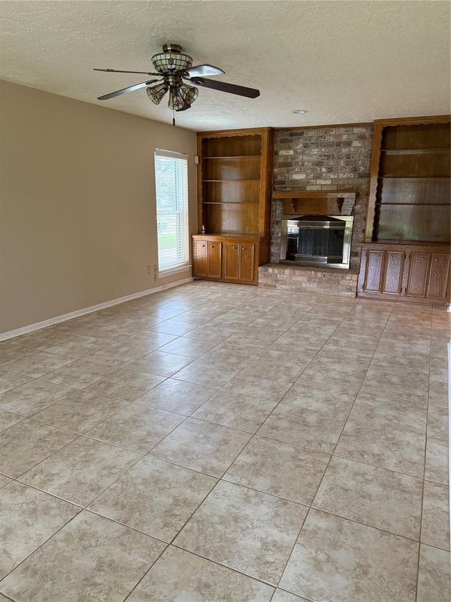 Spacious den, perfect for entertaining. | Image 6