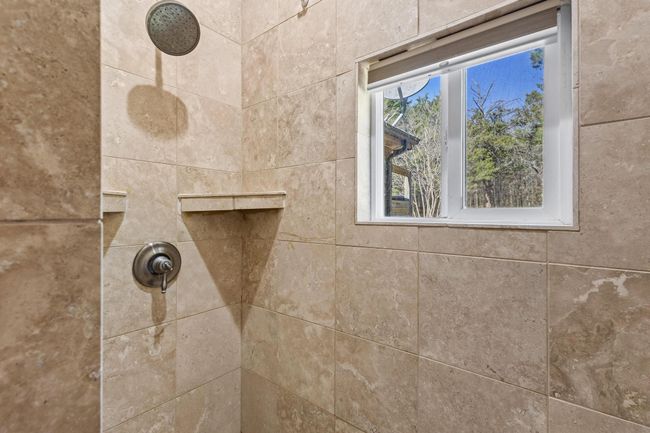 Room details with tiled shower | Image 34