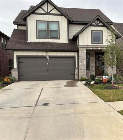 View of front of house featuring a garage | Image 1