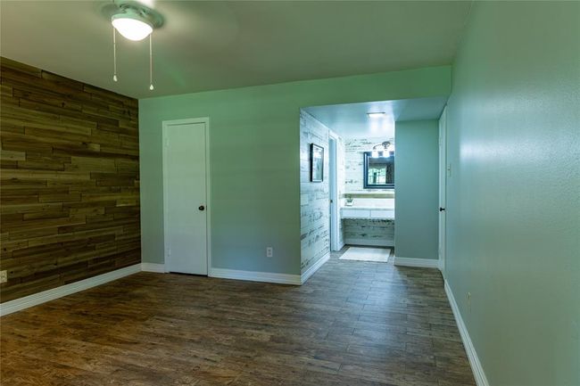 View from primary bedroom toward bath vanity. | Image 31