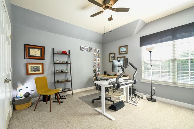 Another nice-sized bedroom with a ceiling fan, carpet flooring, and a walk-in closet. | Image 23