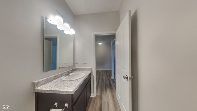bathroom with wood finished floors and vanity | Image 15