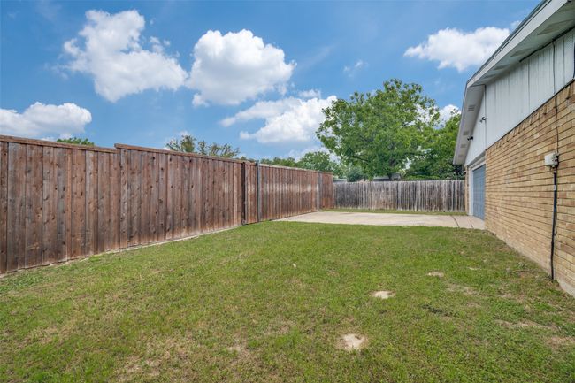 Fenced backyard featuring a patio area | Image 25