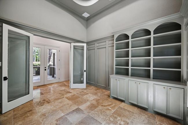 Double French Doors and Travertine Floors Complete This Private Office Space | Image 27