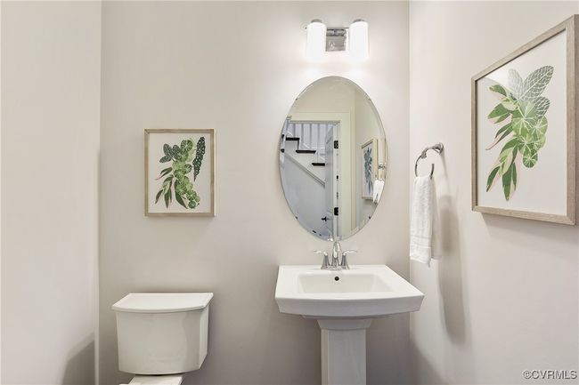 Half bath with a sink and toilet | Image 38