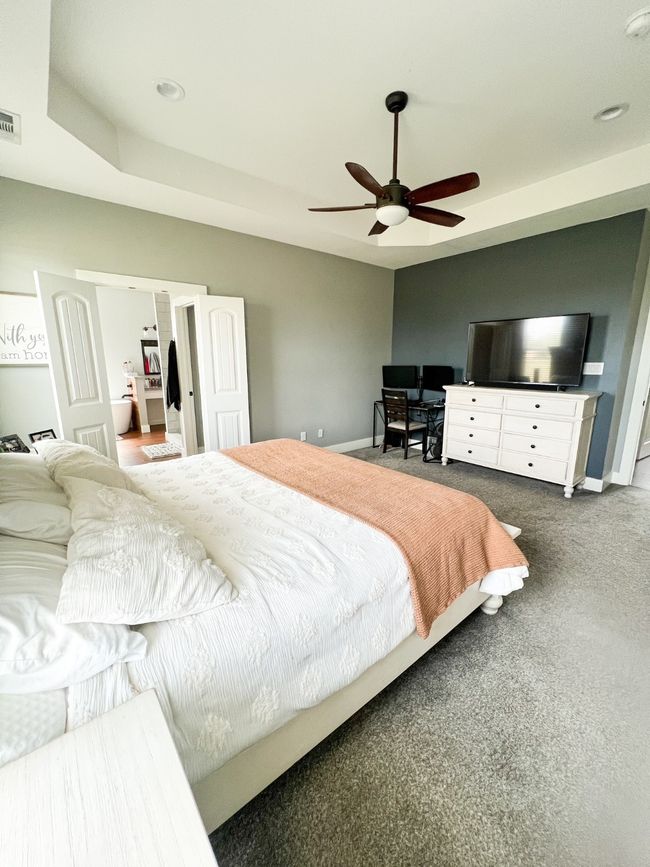 Carpeted bedroom with ceiling fan | Image 18