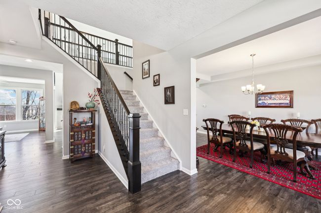 The entry leads you to either the dining room, main floor ensuite bedroom or upstairs. | Image 18