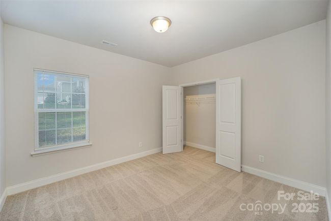 This is the upstairs 4th bedroom with a wide and deep 2 door closet. | Image 27