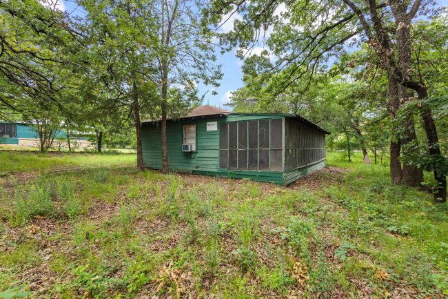 View of yard with a sunroom | Image 35