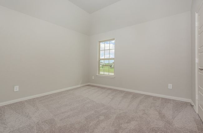 Carpeted spare room with baseboards | Image 24