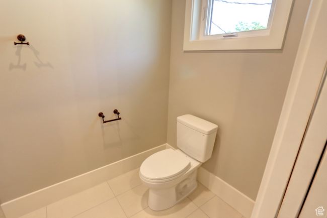 Bathroom featuring toilet and tile patterned flooring | Image 22