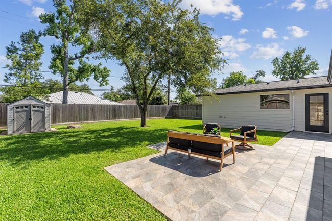 Extensive updates since 2022 include a 30-year composite roof, updated underslab sewer lines, PEX water supply lines, grounded copper wiring, a new electrical panel and service weatherhead, a fully replaced HVAC system including ductwork, and energy-efficient windows and doors. | Image 31