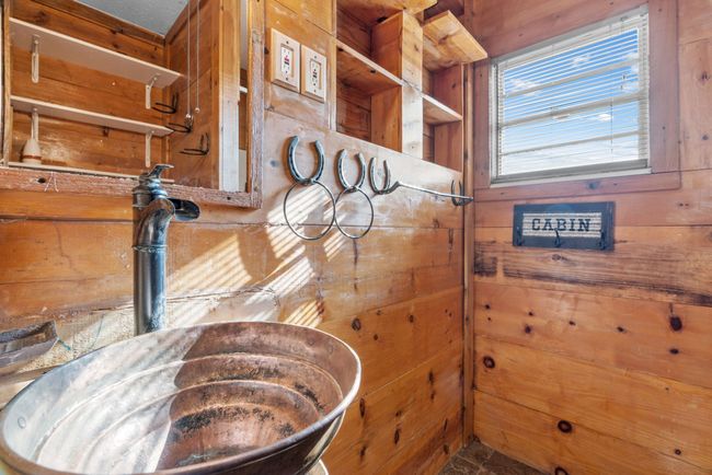 Detailed view of wood walls and a sink | Image 20