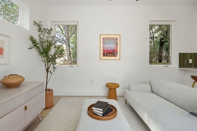 Living room featuring plenty of natural light and baseboards | Image 4