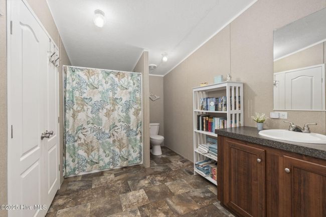 Spacious walk-in closet off bathroom | Image 21