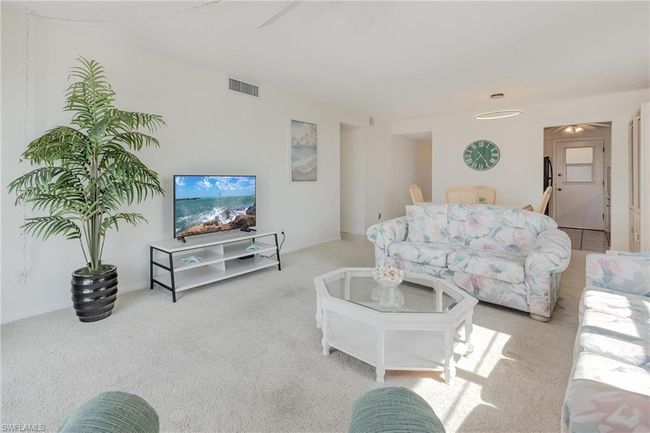 Living room with carpet floors | Image 9