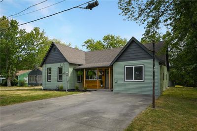 View of front of house with a carport and a front lawn | Image 3