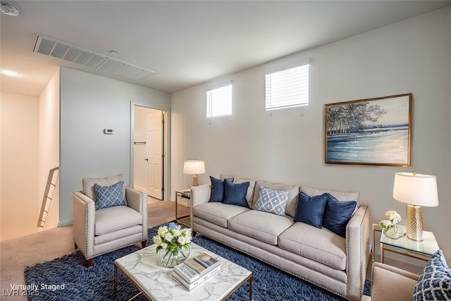 Living room with carpet floors and visible vents **VIRTUALLY STAGED** | Image 8