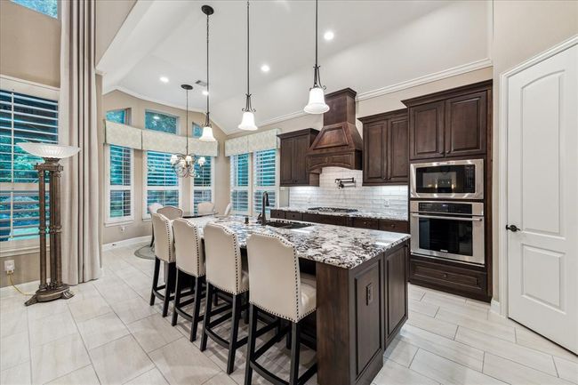 Pot filler and new tiled back splash make this kitchen a cook's dream. | Image 10