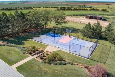 View of sport court with a yard and a rural view | Image 3