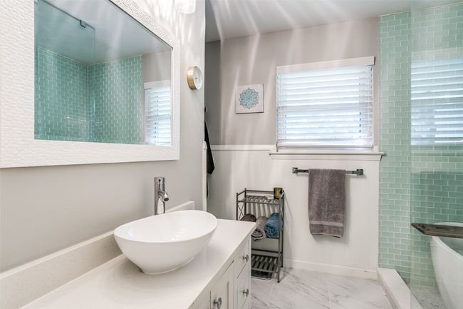 Full bath with vanity and marble finish floors | Image 21