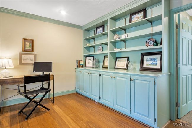 Office space featuring light wood-style flooring, crown molding, and baseboards | Image 16