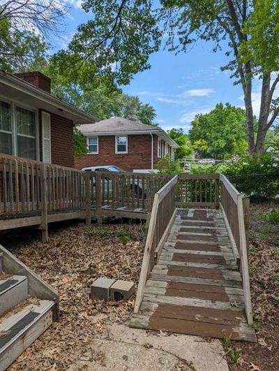 View of yard with a wooden deck | Image 2