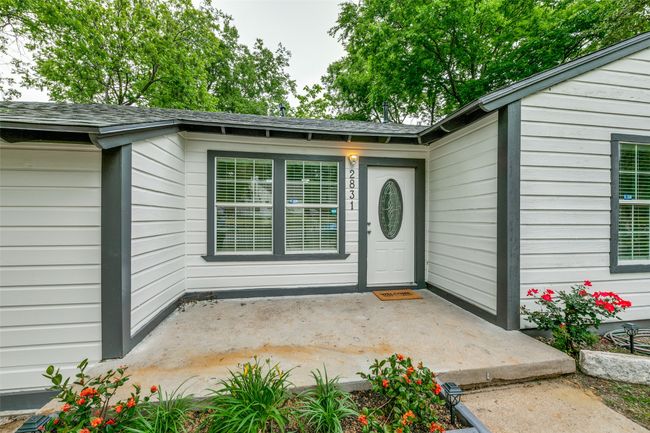 Property entrance with a shingled roof | Image 5