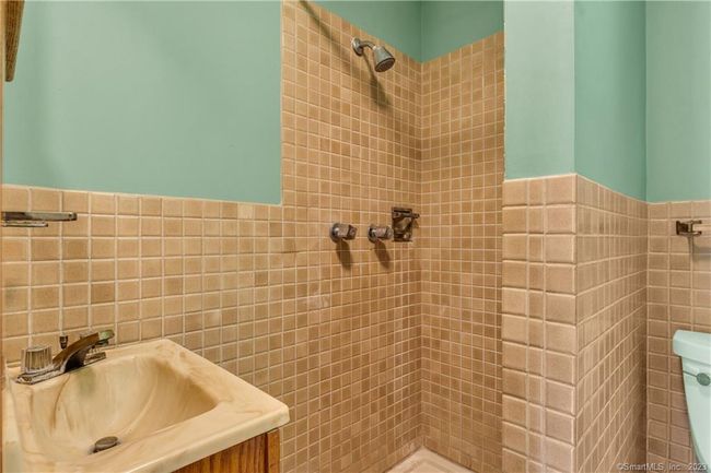 The Primary en suite Bath has a tiled shower. | Image 17