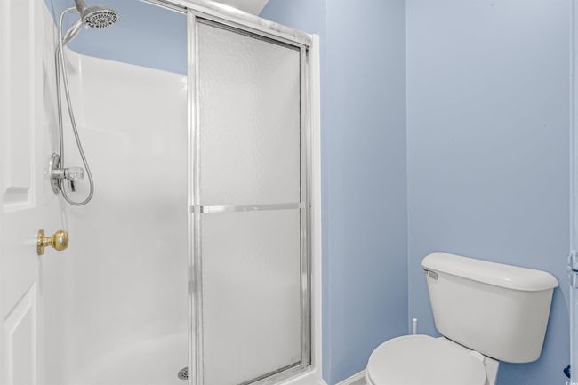 Full bathroom with a shower stall and toilet | Image 25