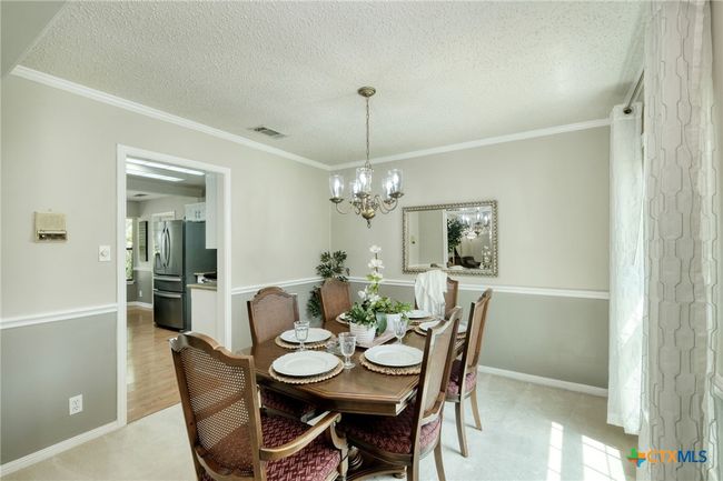 Formal Dining area with door leading to the kitchen | Image 7