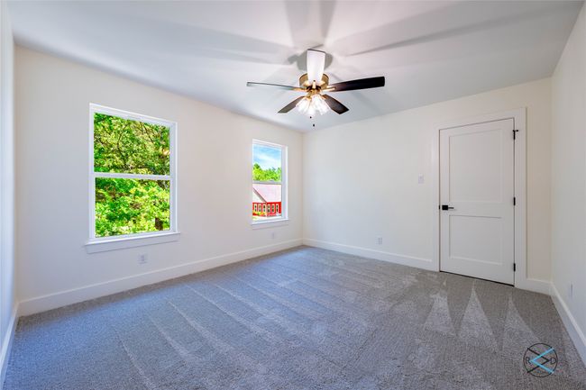 Carpeted spare room with ceiling fan | Image 12