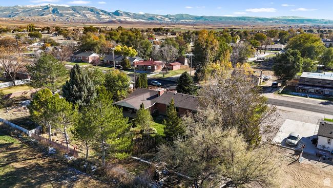 Aerial view of residential area featuring a mountainous background | Image 26