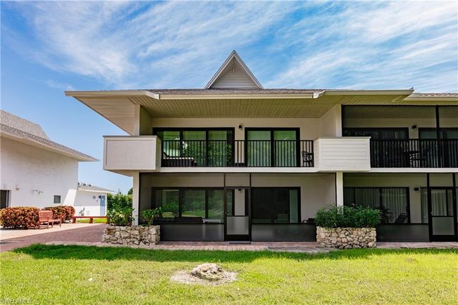 Back of property featuring a lawn, a balcony, and stucco siding | Image 27
