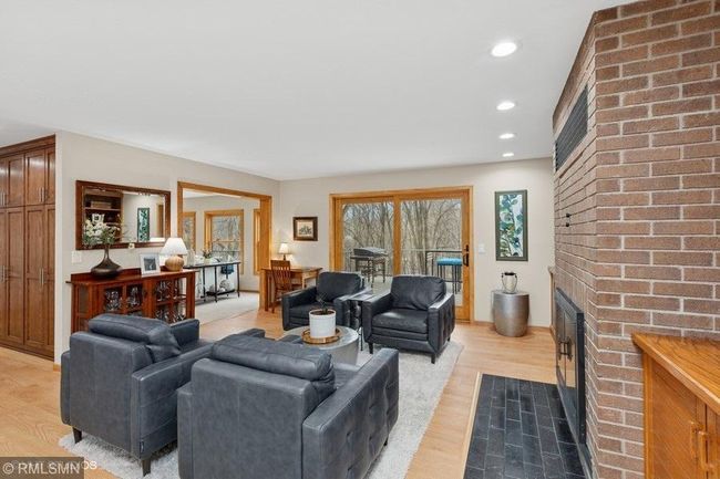 Patio door in family room leads to the amazing deck that overlooks the backyard! | Image 14