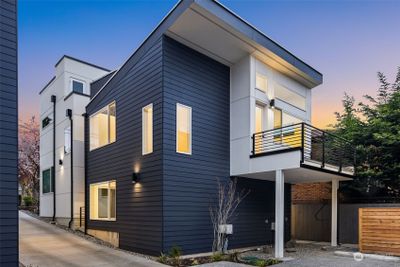 Elegant standalone homes bathed in the warm glow of dusk offer modern living in Capitol Hill's vibrant heart. | Image 2