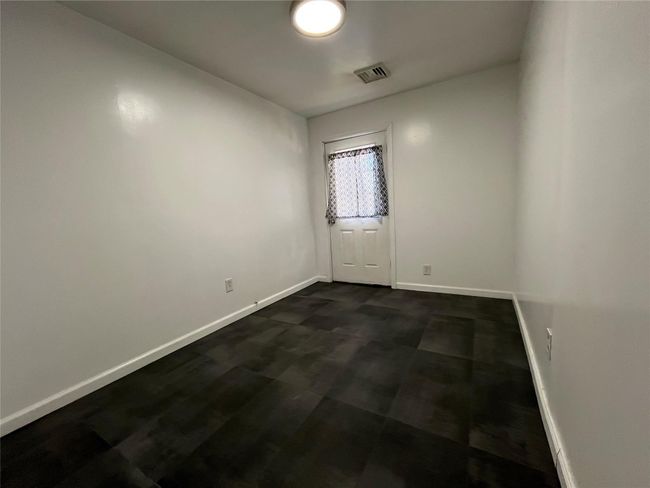 Another view bonus room with door out to back | Image 17
