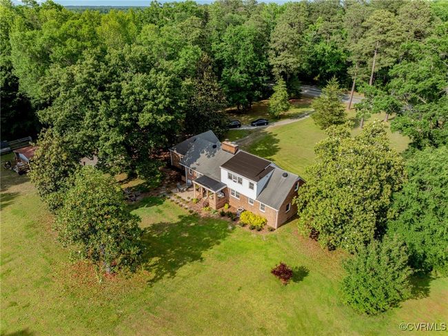 View from above of property with a heavily wooded area | Image 47