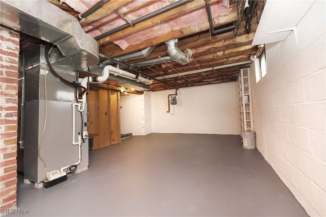 Unfinished basement with heating unit | Image 33