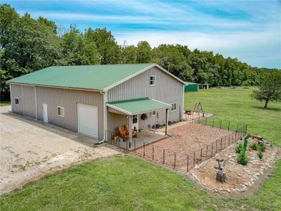 View of outdoor structure with a garage and a yard | Image 2