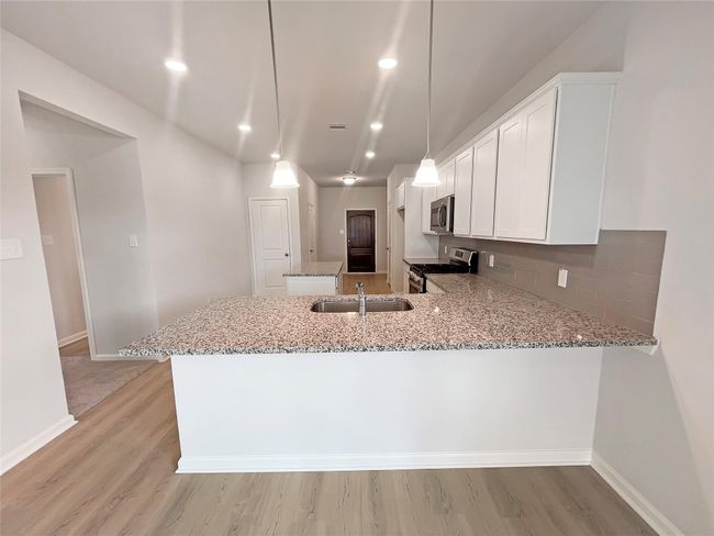 The Cardinal II- Dining Area into Kitchen | Image 6