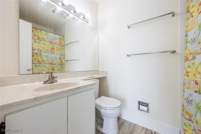 Bathroom with single vanity and shower / tub combo. | Image 31